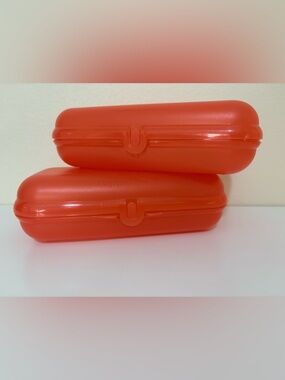 Tupperware  Oysters Twin" or "Sandwich Keeper") hinged containers.